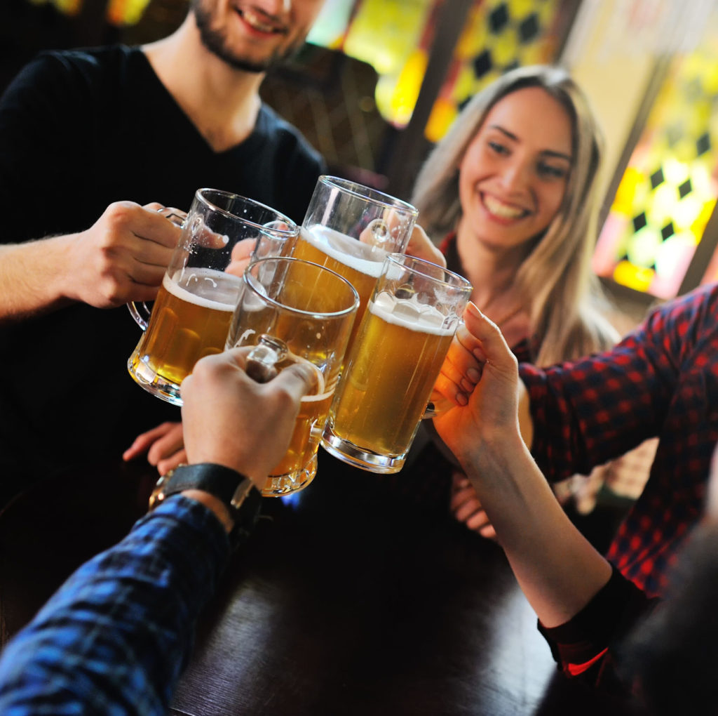 People holding glasses of beer